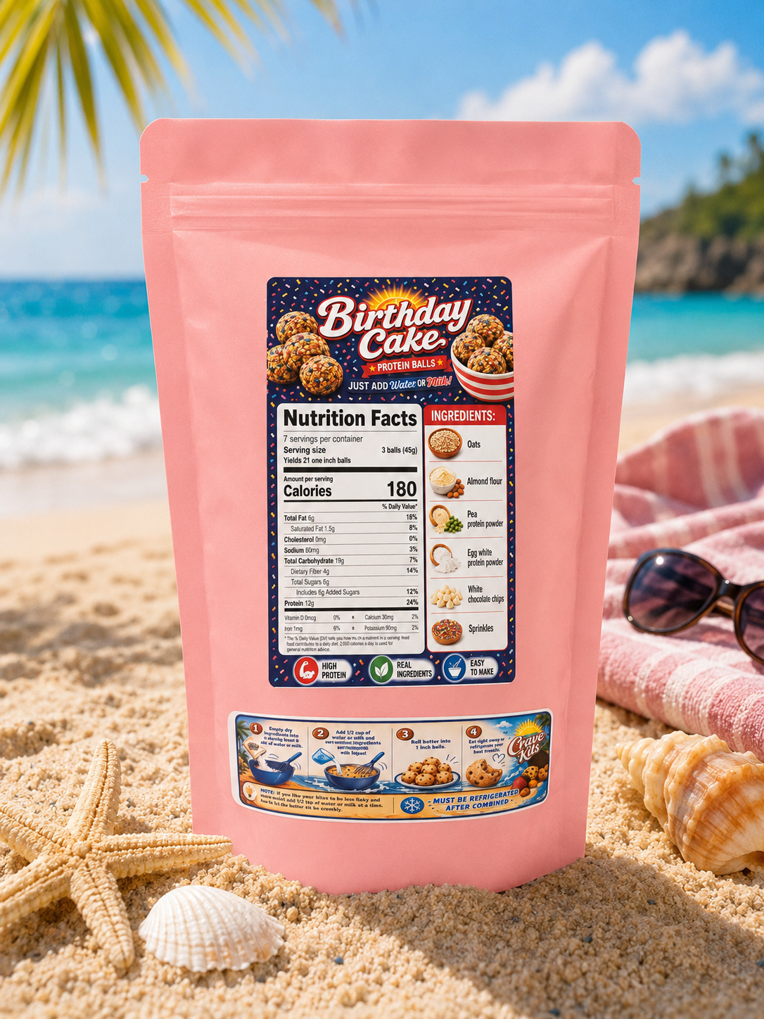 Back of Crave Kits Birthday Cake Protein Ball Mix package on a beach-themed background, displaying nutrition facts, ingredients, preparation instructions, and product details for a high-protein healthy dessert mix.